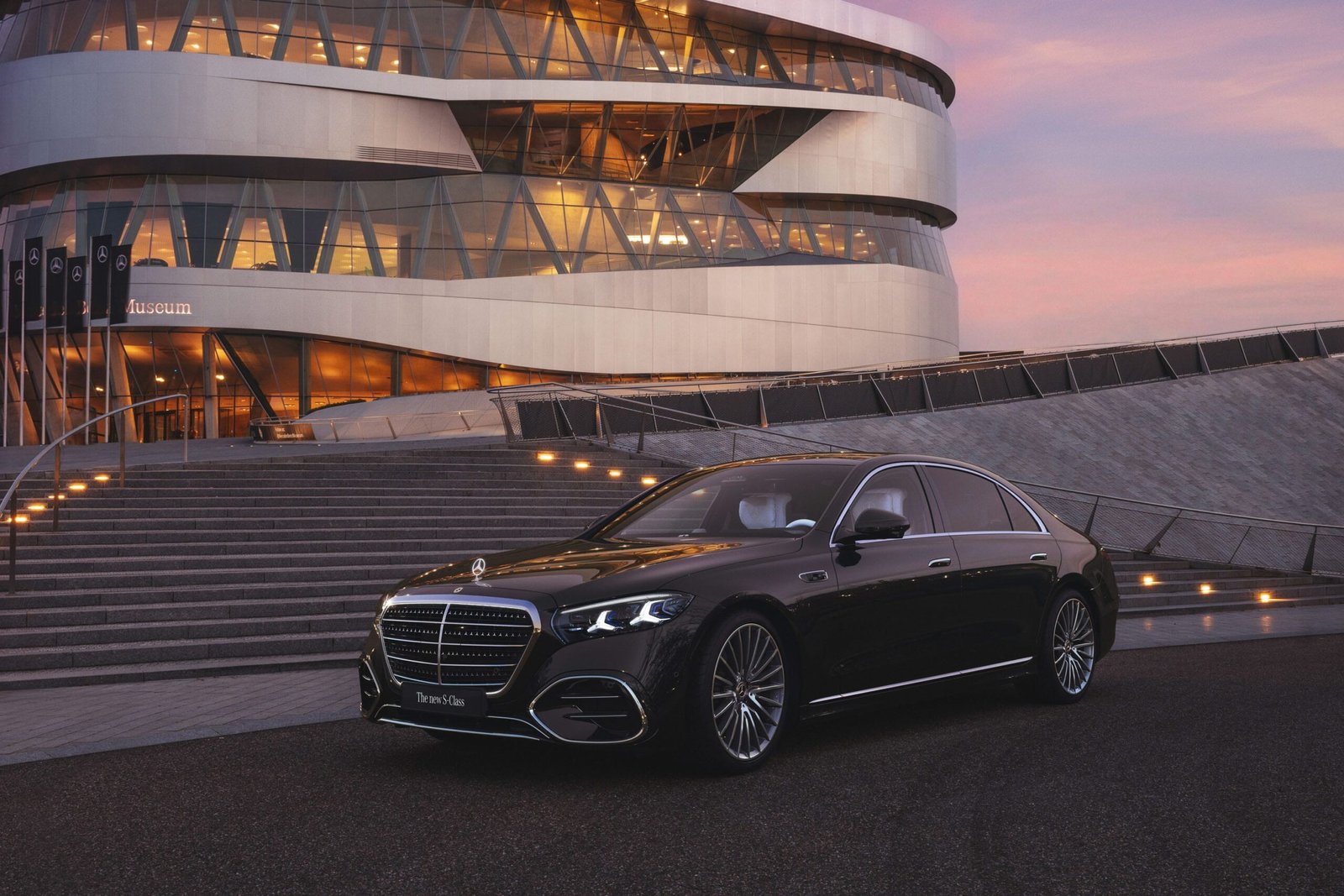 Black Mercedes-Benz S-Class sedan, front three-quarter view